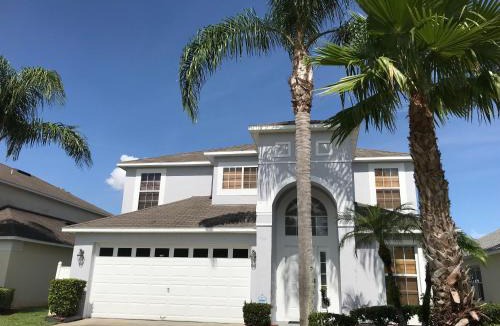 Lake Berkley Villa | Sunny South Facing Pool with Hot Tub and Lake View Near Disney