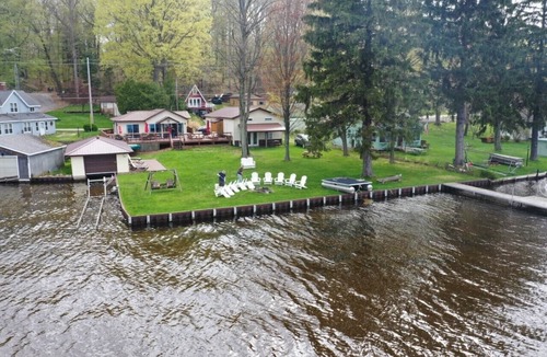 Ludington Cottage | The Bunkalow Lakefront Compound w Lifts for your Speed Boat & Tritoon