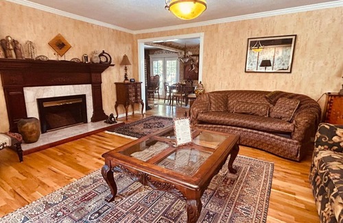 North End House | The Doll House an eclectic style of art and old fashioned doll and antique collections in a doll house designed home in Boise's desirable North End across from a nice park with tennis and basement and walking trails near shopping, hiking, biking, skiing