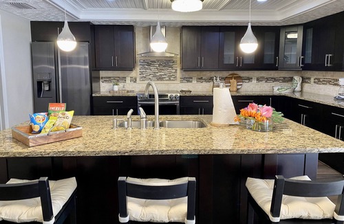 Town 'n' Country Villa | Tuscany Villa Backyard Oasis in the Heart of Tampa