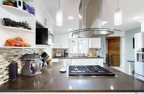 Brighton House | Vivid colorful craftsman with patio and fire pit