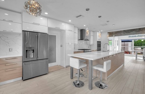 Poinsettia Heights House | Walk to Beach Heated Pool + EV Charger Near Las Olas | Dolphin Isles Oasis
