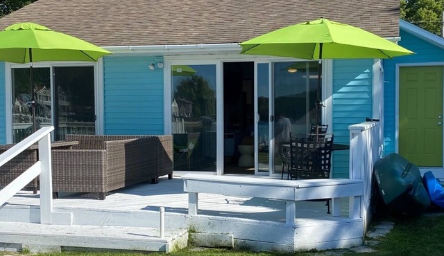 Charming 2-bedroom waterfront cottage with AC & WiFi located in Norton Shores.