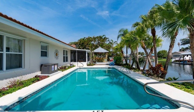 Cocoa Beach Waterfront Home with Tiki Bar and Pool