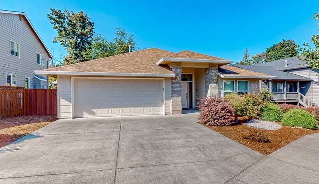 Custom-built home alongside greenspace with deck & massage chairs