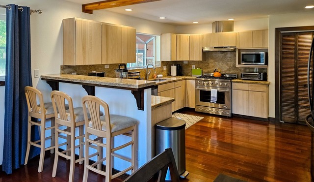 Magical estate & detached guest suite with hot tub, game room, pond & playset