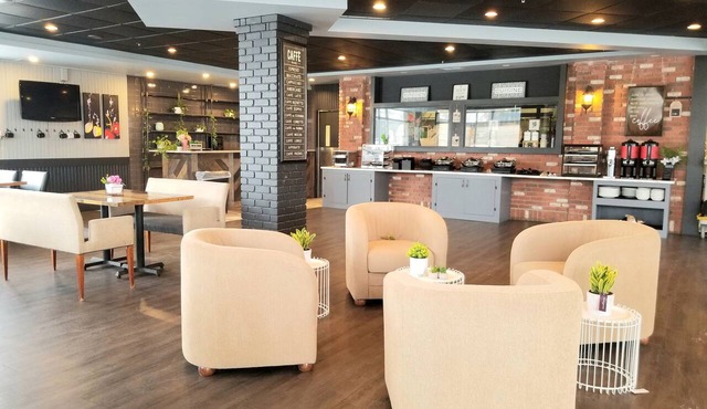 Merit Hotel & Suites