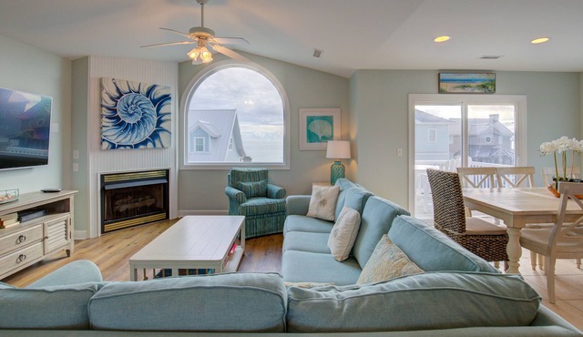 Ocean-view 2-story home with fireplace, community outdoor pool & tennis court