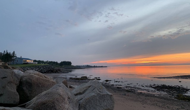 Oceanfront beach cottage panoramic views spectacular sunsets sandbars warm water