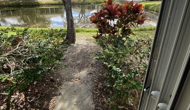 One story Villa in golf community with lake view & walking path