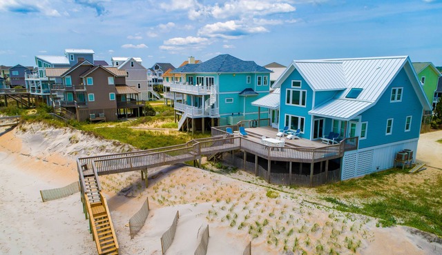 Quaint beachfront cottage with Ping-Pong table, decks, community pool & views