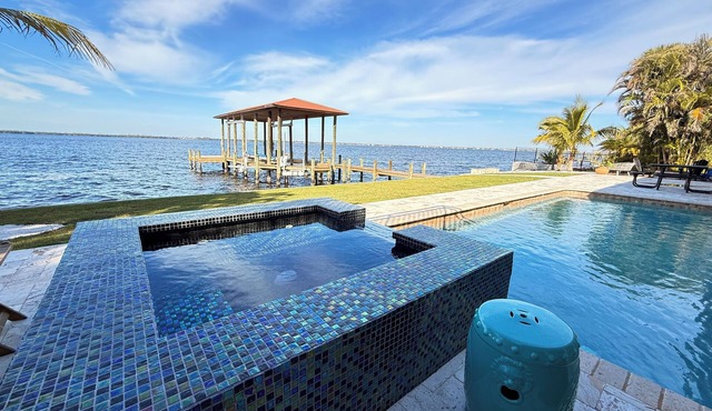 Riverfront 5 bedrooms, 5 baths , pool , spa , beach , dock and stunning views !