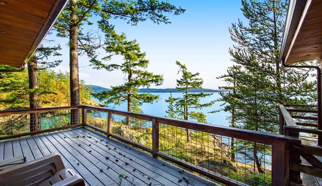 Rustic waterfront cabin w/free WiFi, a full kitchen, & furnished decks