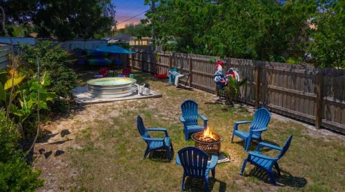 Spacious 4 bedroom 3 bath Clearwater Vacation House Cowboy Pool Fire Pit Games Close to Clearwater Beach Biking Trail Farmers Markets Harbor Health Spa Baycare Ballpark and Ruth Eckerd Hall Golf Courses