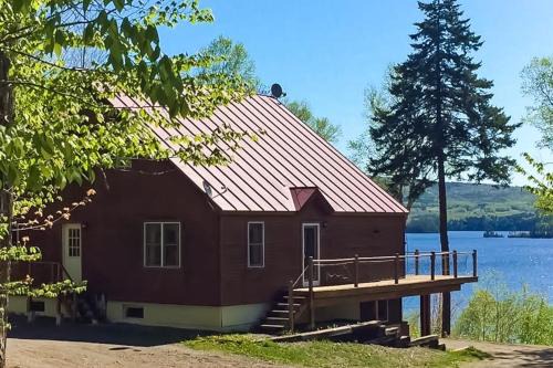 Spectacular lakefront home with dock, firepit, & vaulted ceilings - dog-friendly