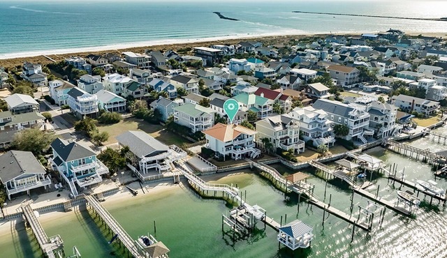 Waterfront 5 BR home w/incredible views, dock, boat slips, & elevator!